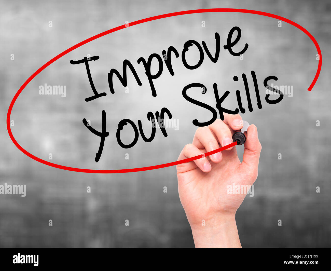 Man Hand writing Improve Your Skills with black marker on visual screen ...