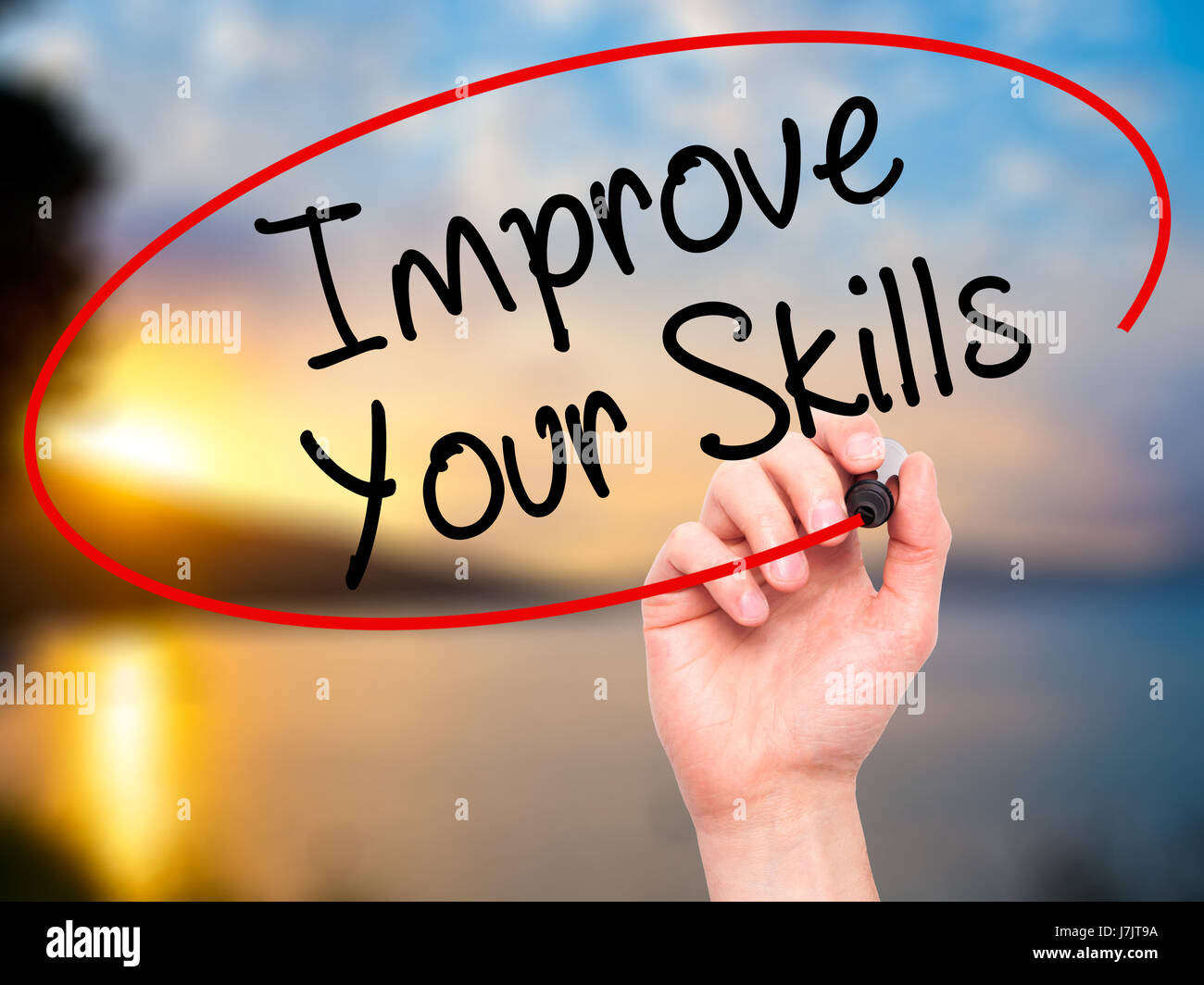 Man Hand writing Improve Your Skills with black marker on visual screen ...