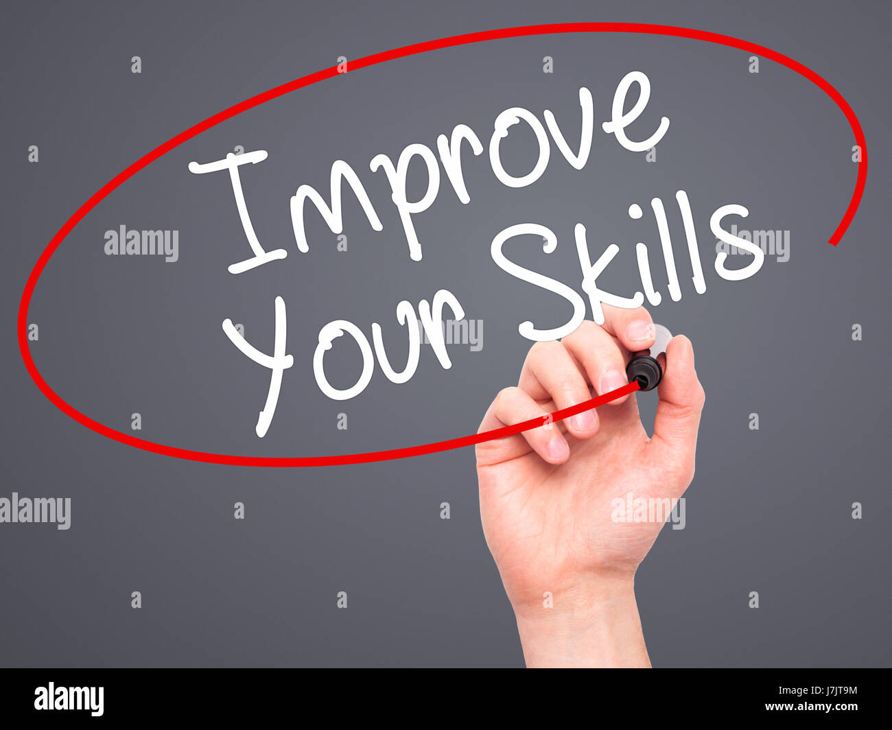 Man Hand writing Improve Your Skills with black marker on visual screen ...