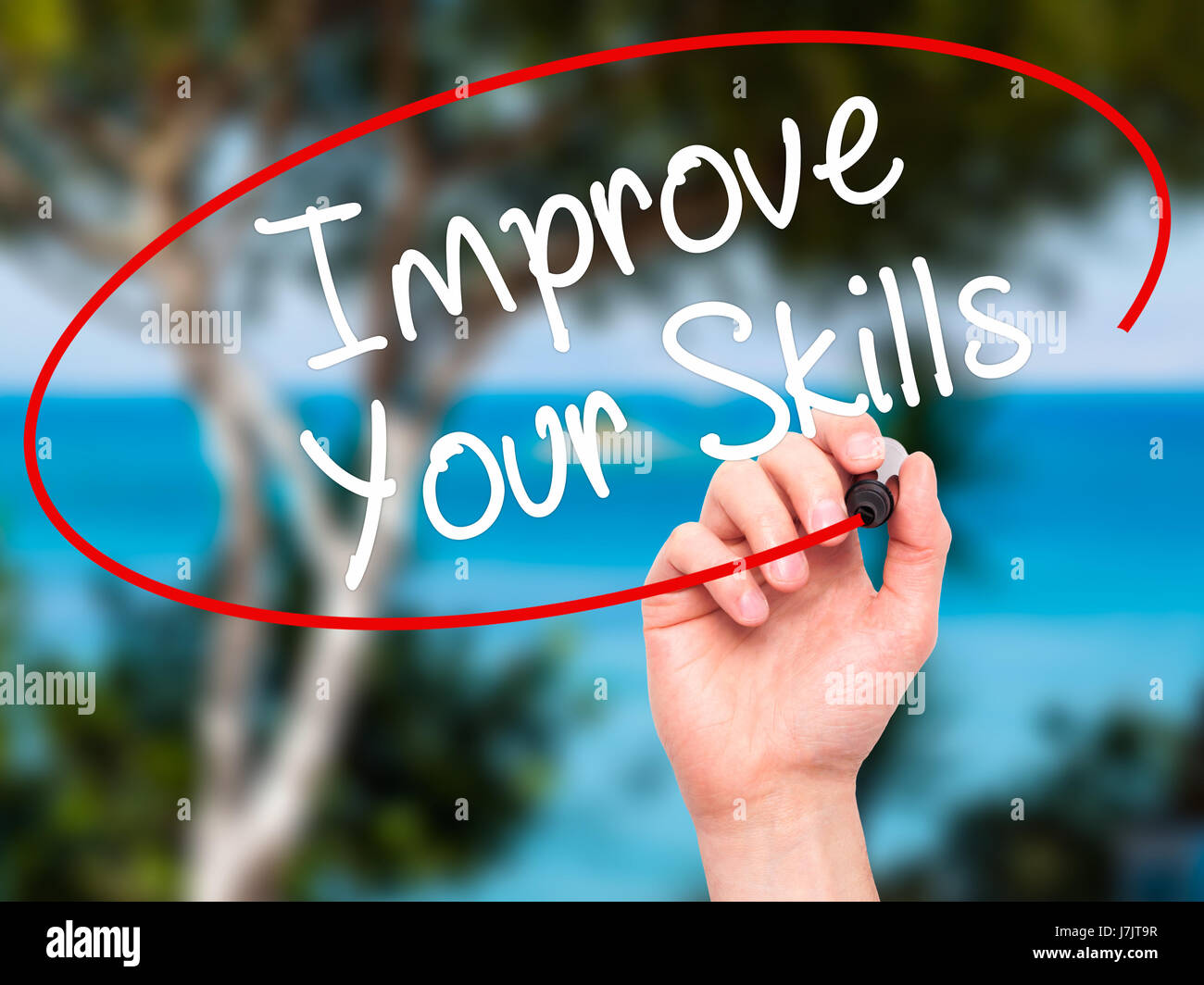 Man Hand writing Improve Your Skills with black marker on visual screen ...