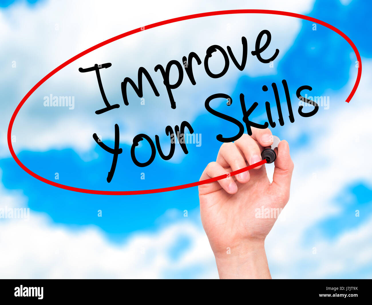 Man Hand writing Improve Your Skills with black marker on visual screen ...