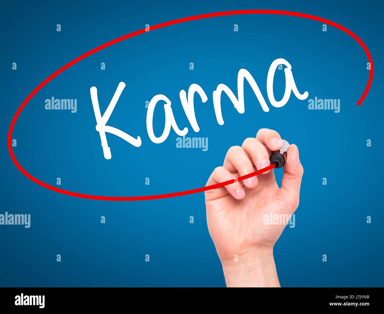 Man Hand writing Karma  with black marker on visual screen. Isolated on background. Business, technology, internet concept. Stock Photo Stock Photo
