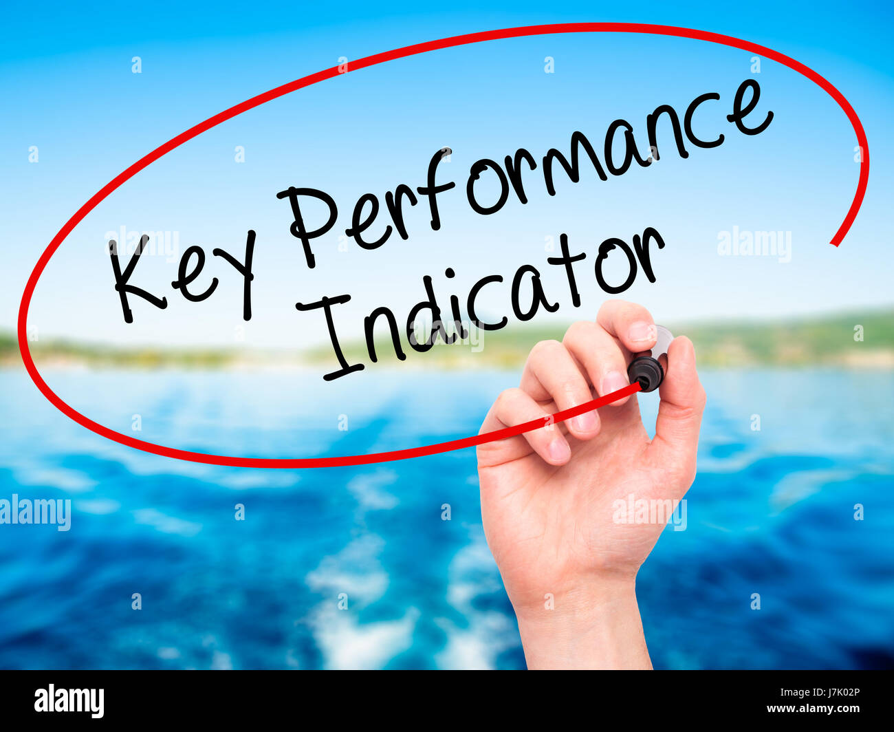 Man Hand writing Key Performance Indicator with black marker on visual ...