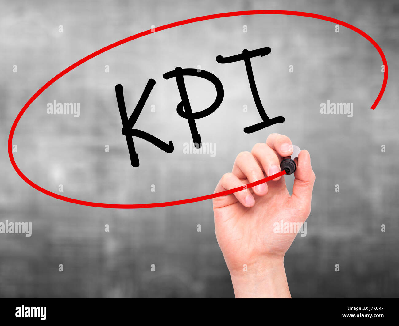 Man Hand writing KPI (Key Performance Indicator) with black marker on ...