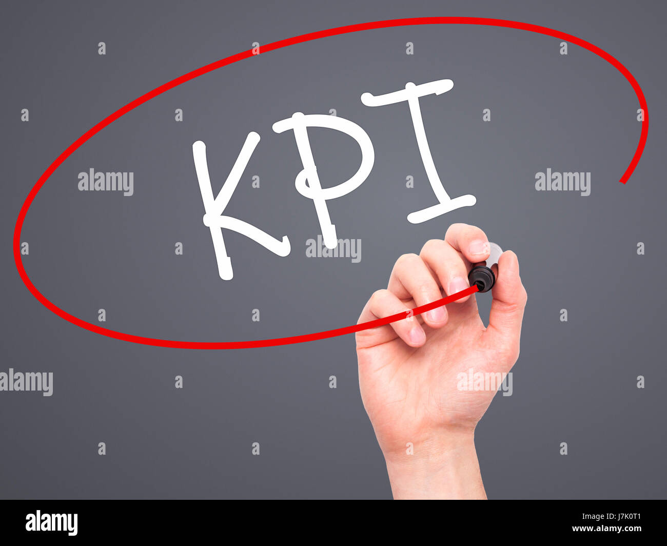 Man Hand writing KPI (Key Performance Indicator) with black marker on ...