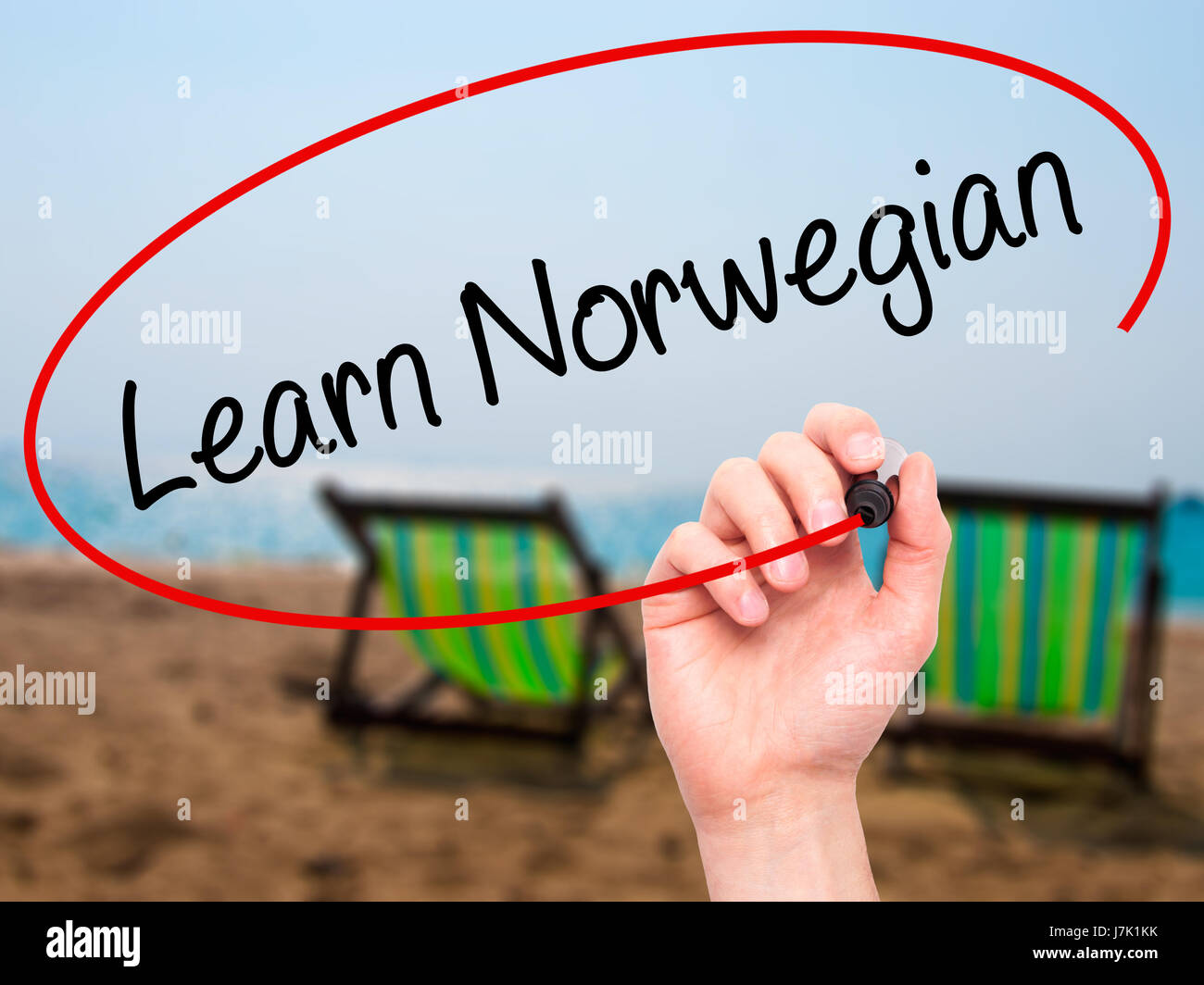 Man Hand writing Learn Norwegian with black marker on visual screen ...
