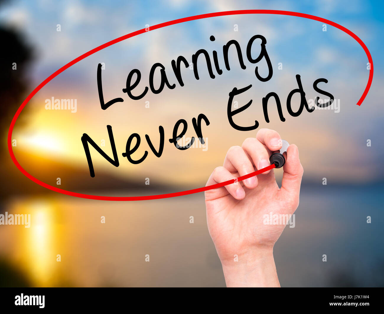 Man Hand writing Learning Never Ends with black marker on visual screen ...