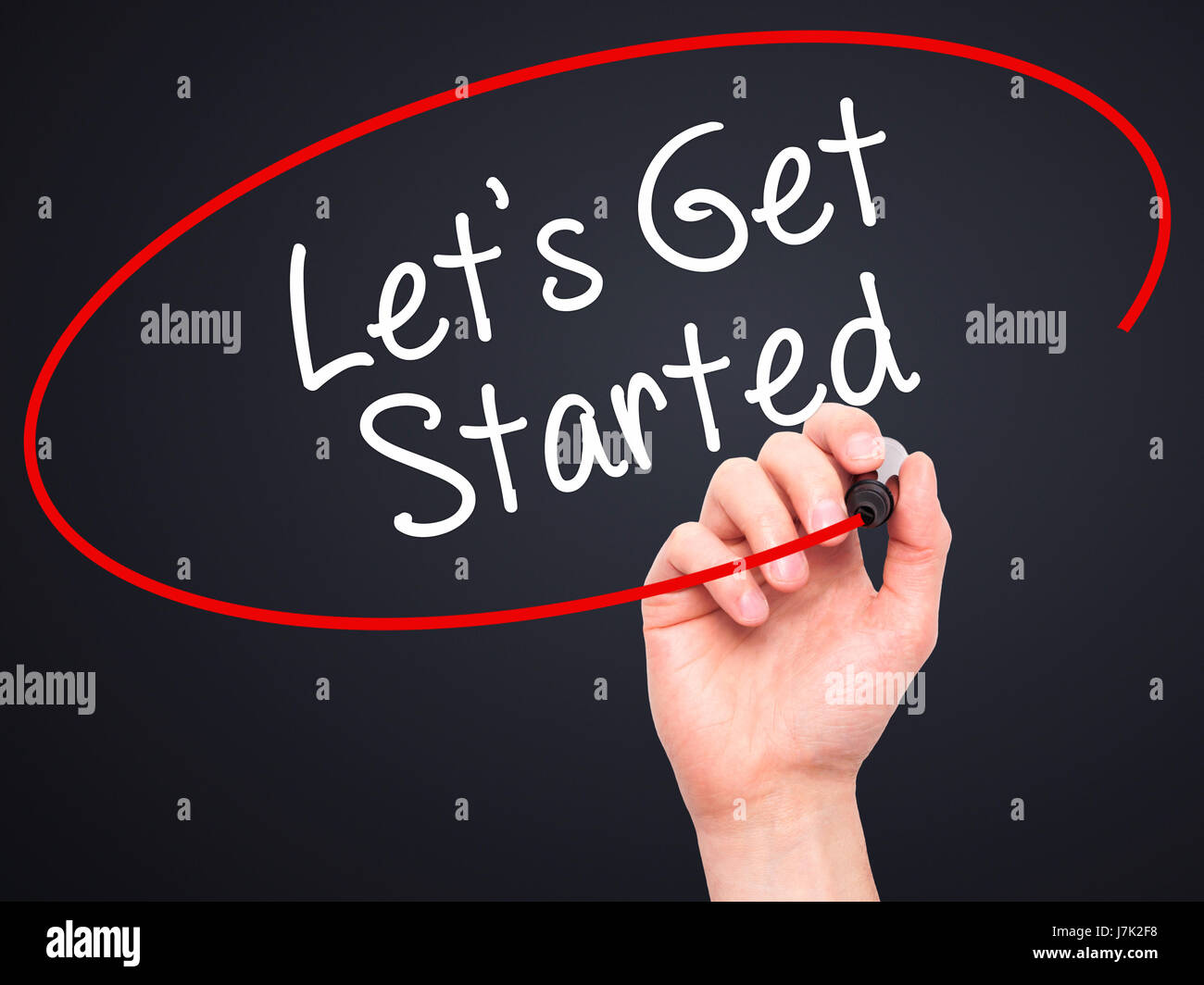 Man Hand writing Lets Get Started with black marker on visual screen ...
