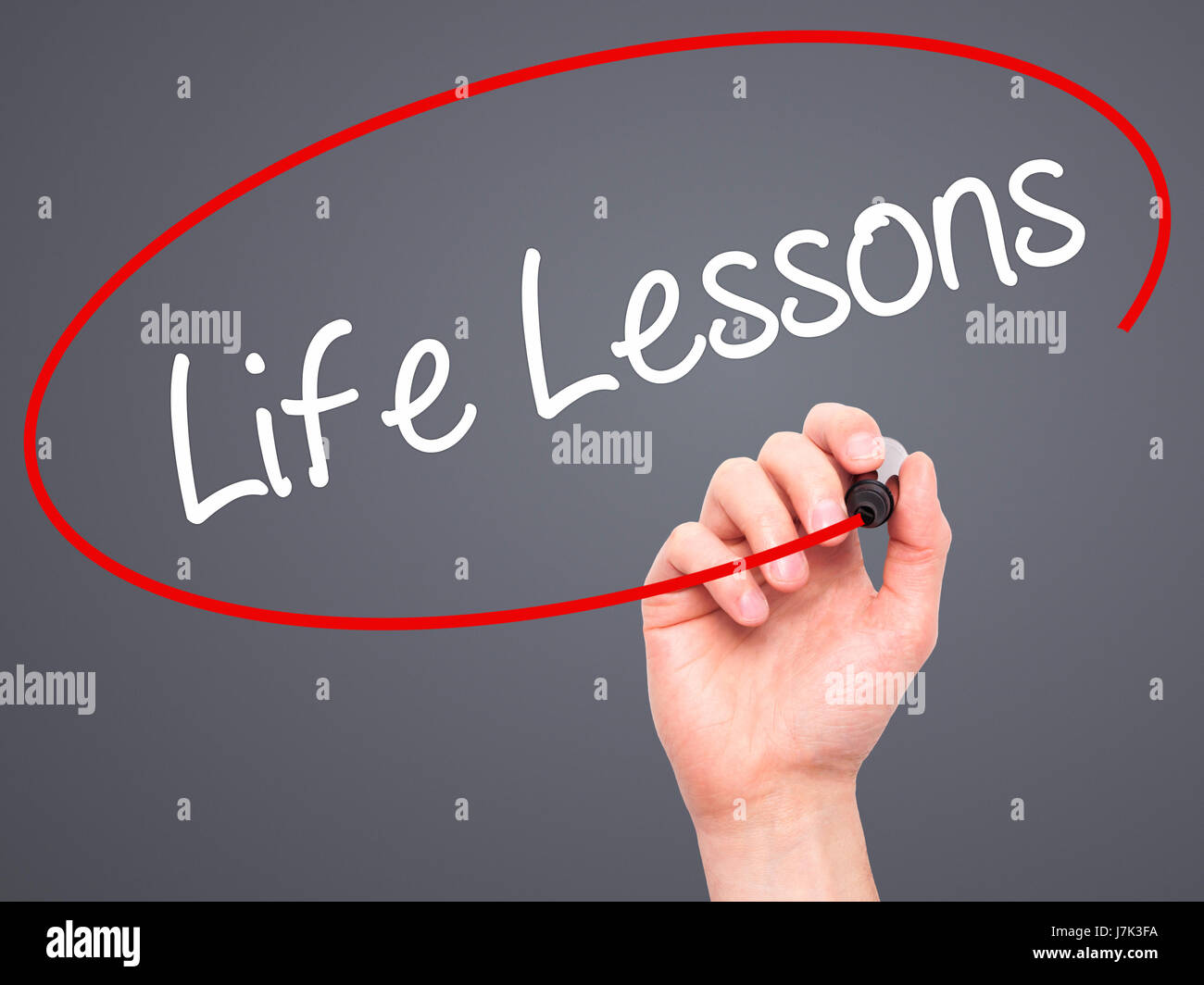 Man Hand writing Life Lessons with black marker on visual screen ...