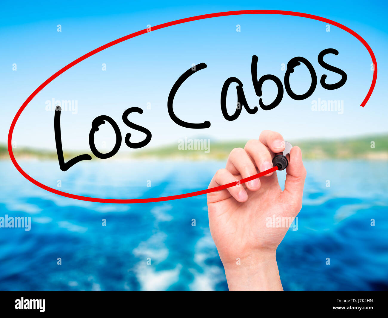 Man Hand writing Los Cabos with black marker on visual screen. Isolated ...
