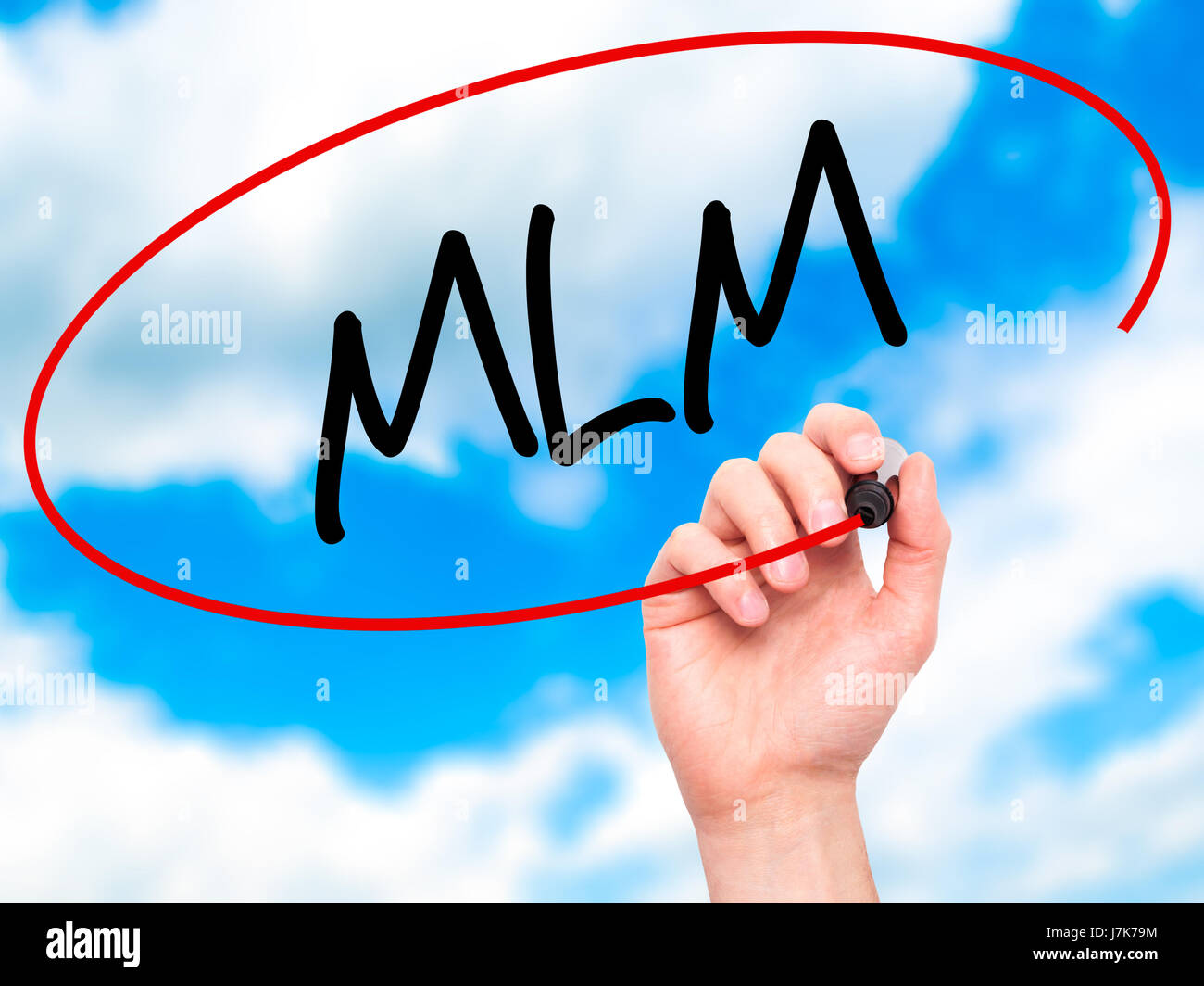 Man Hand writing MLM (Multi-Level Marketing) with black marker on ...