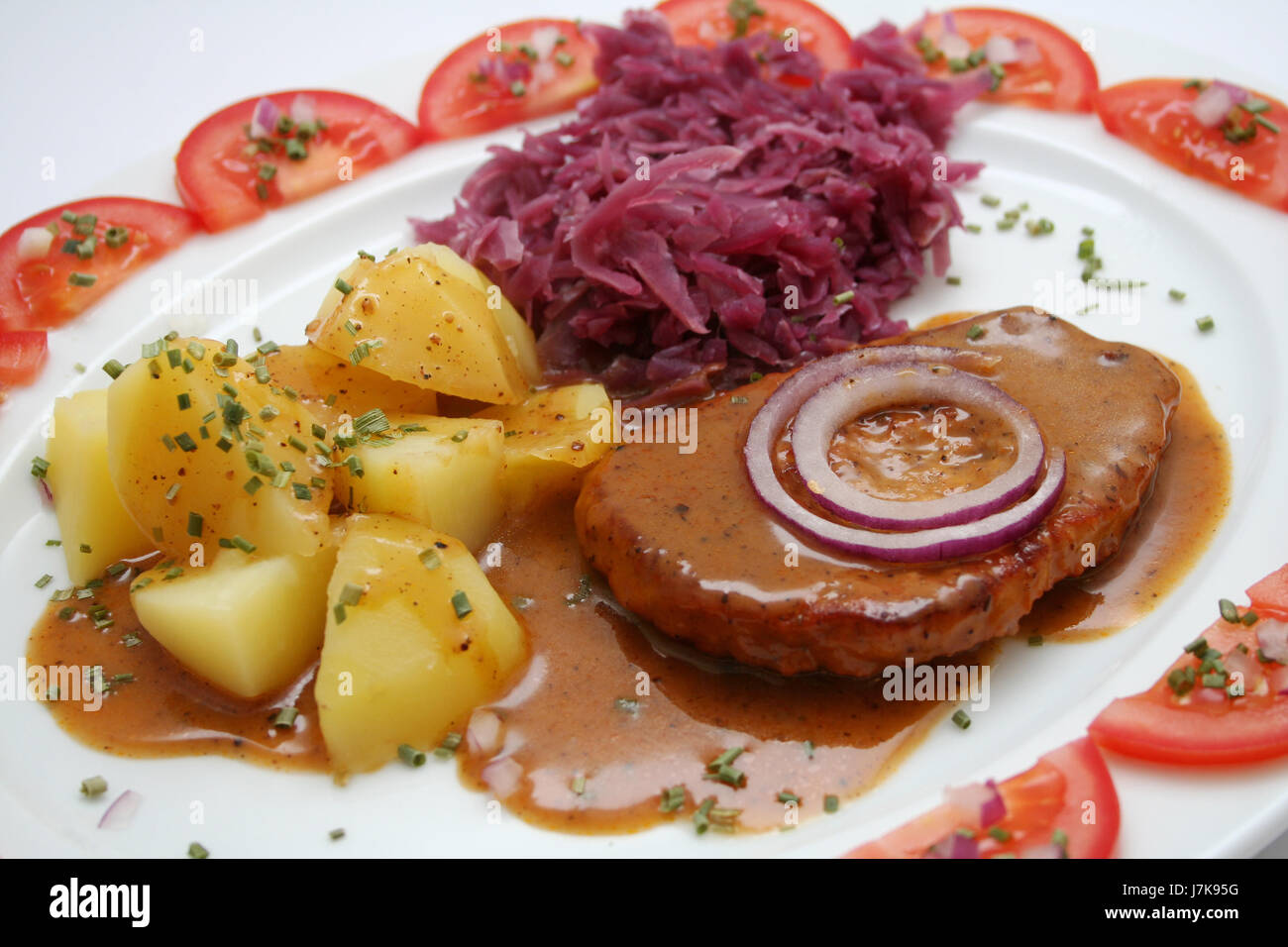 food dish meal lunch boiled potatoes red cabbage plain fare meat food aliment Stock Photo