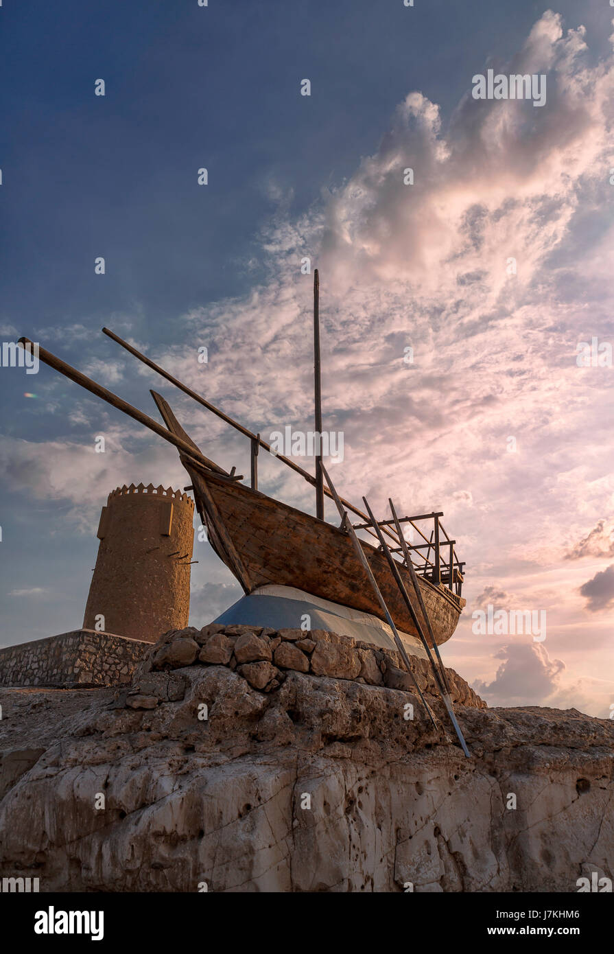 Monument of Dhow boat next to tower along the Al Khor corniche in Qatar, Middle East. Stock Photo
