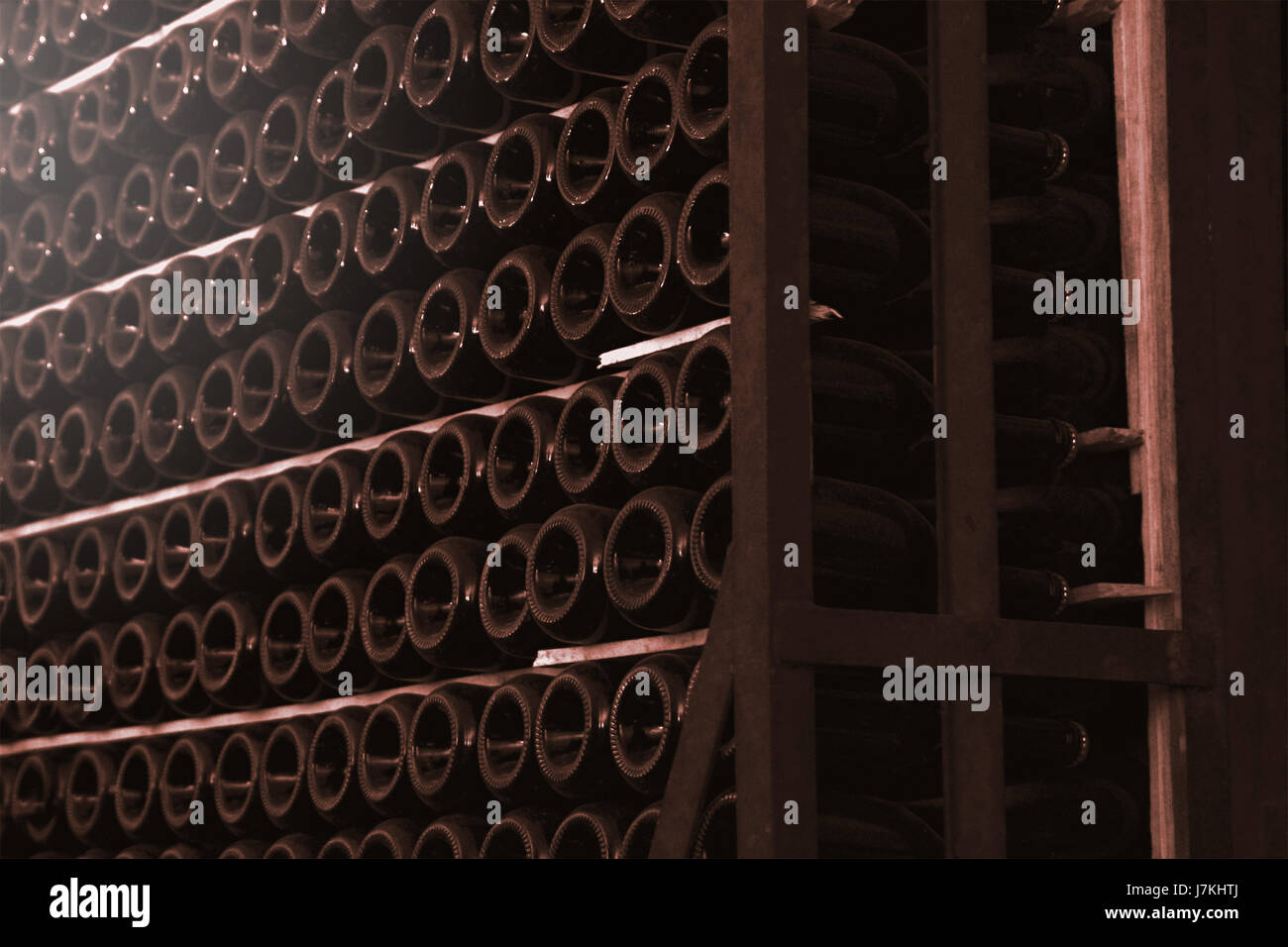 Wine cellar interior and some champagne bottles forming aisles. Winery