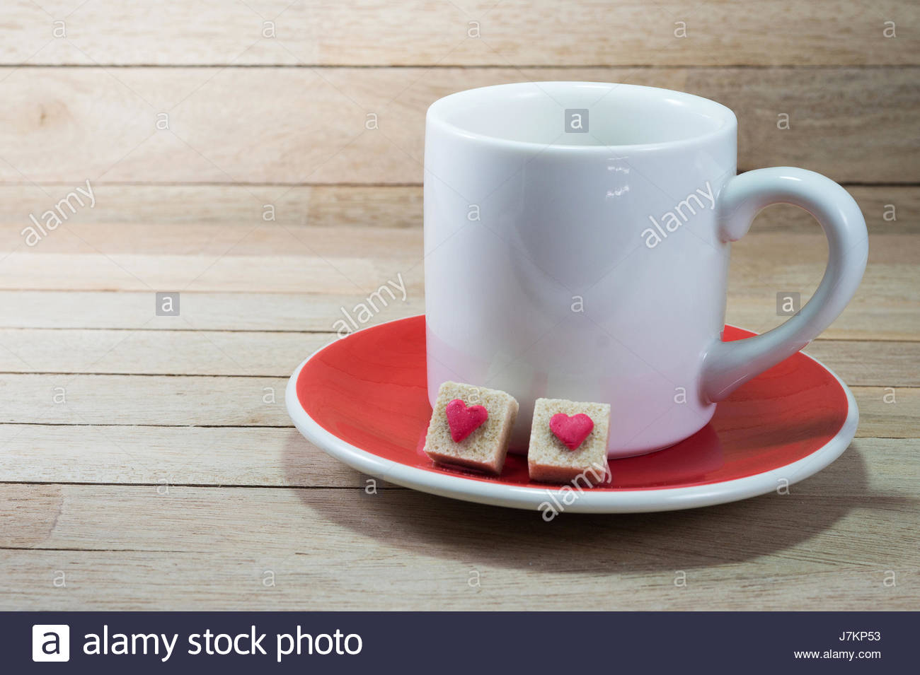 White Coffee Cup With Brown Sugar Cubes Decorated By Little Red