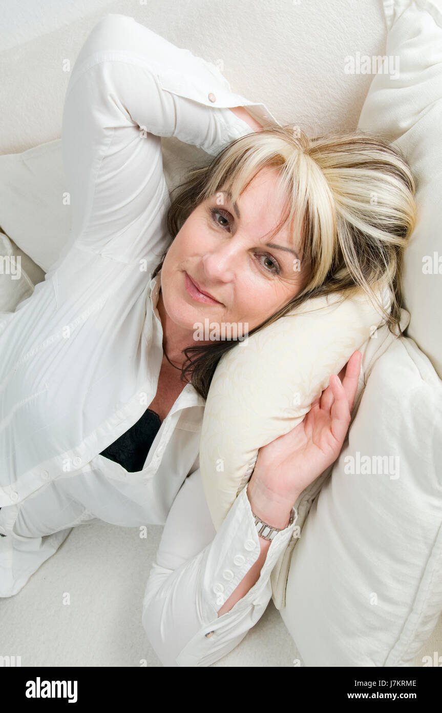 woman person lie lying lies pose adult one woman laugh laughs laughing twit Stock Photo