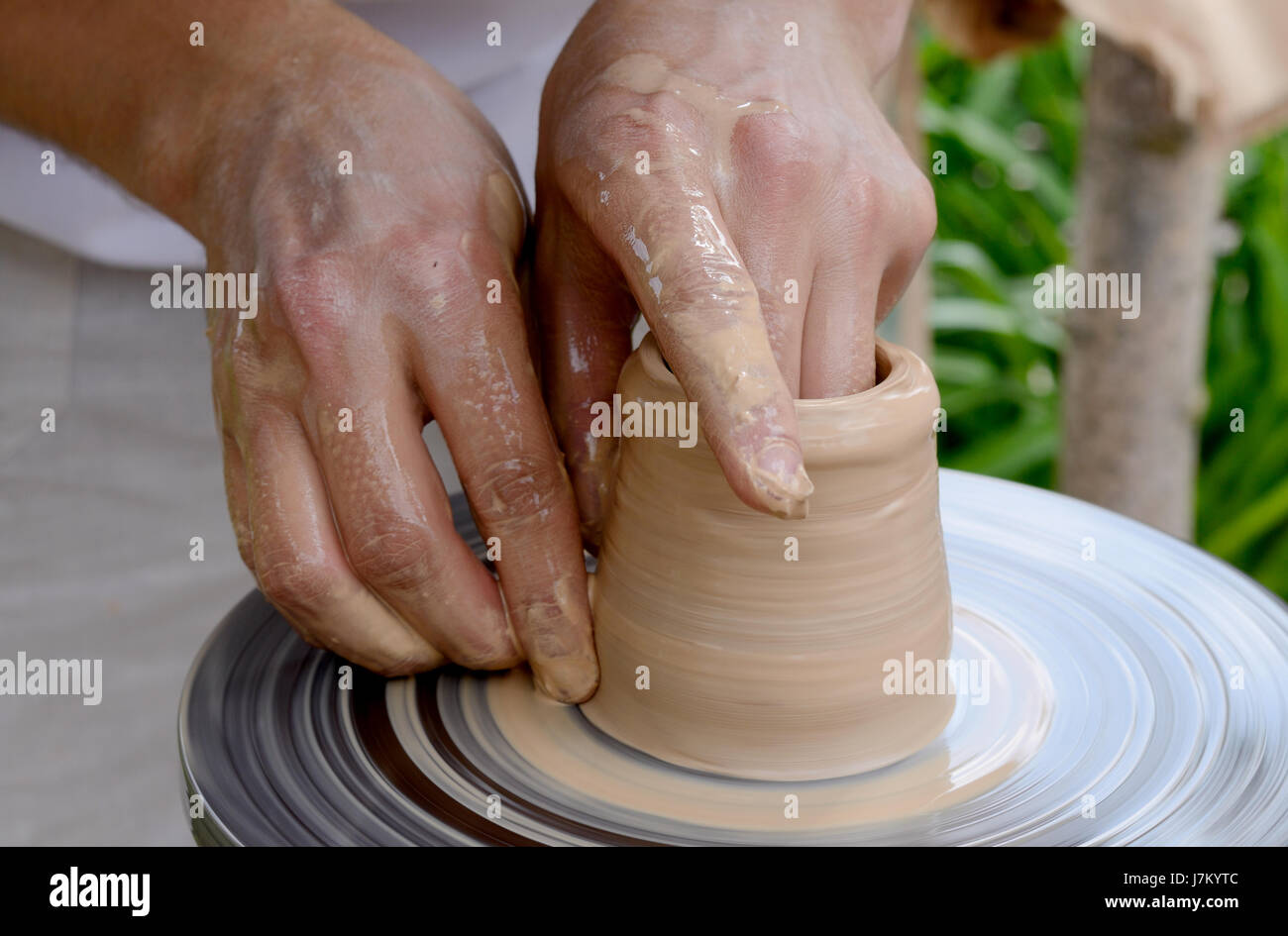 Male potter makes vessel with pottery wheel Stock Photo - Alamy