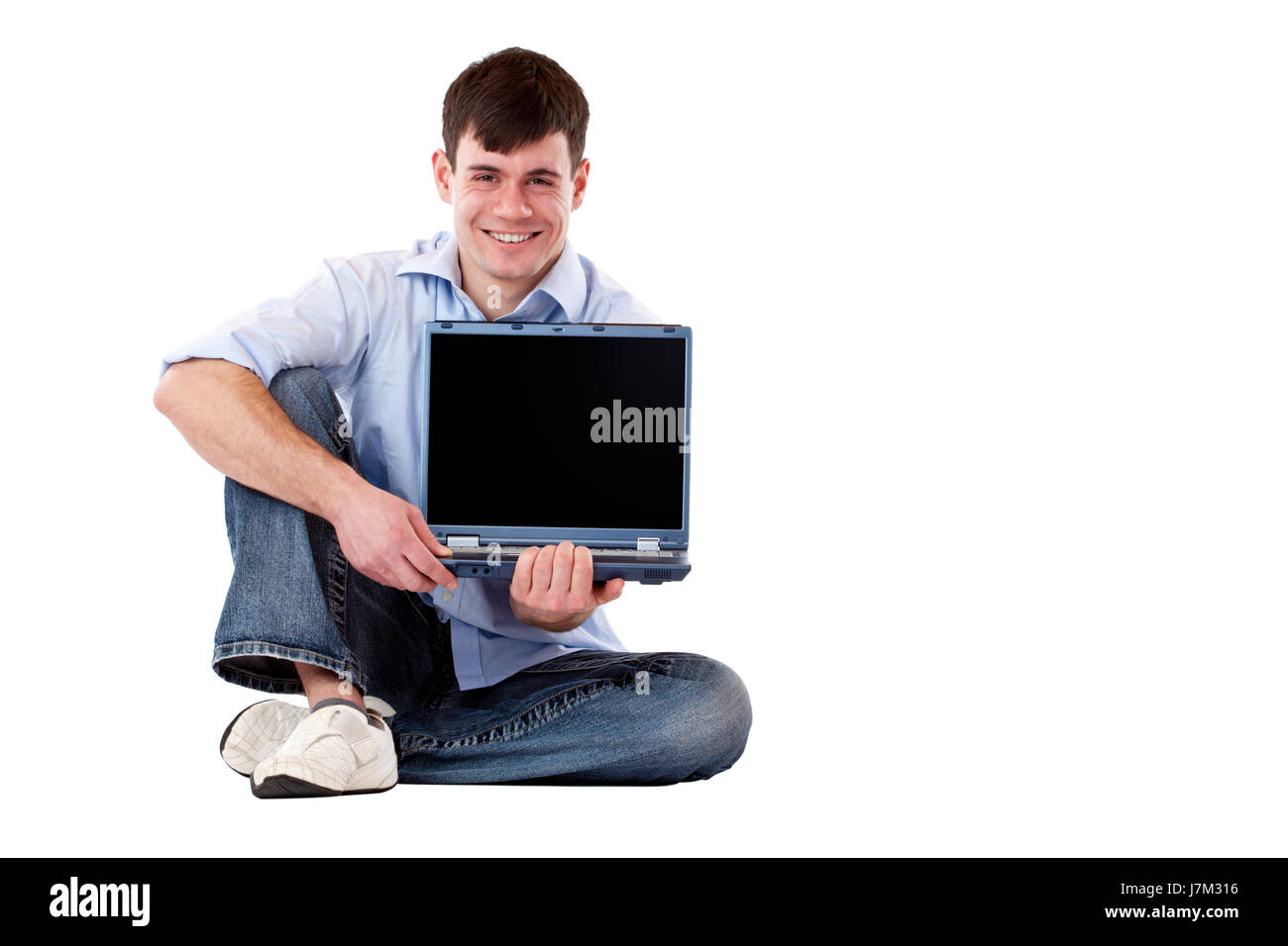 Компьютер и человек. To hold a computer. Мужчина в красном с ноутбуком. Парень с ноутбуком в руках. To hold a computer.