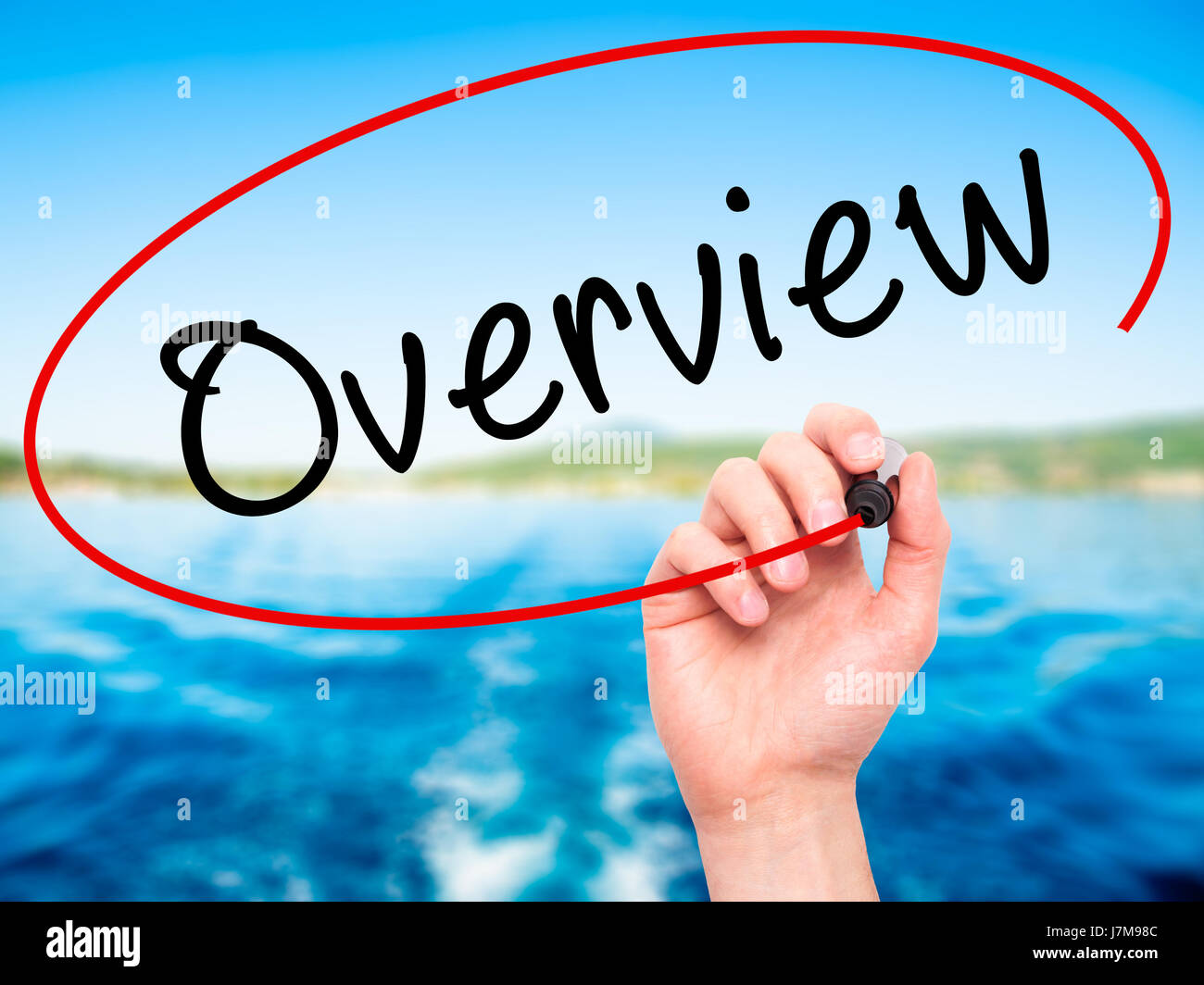 See Overview Man Hand writing Overview with black marker on visual screen. Isolated ...