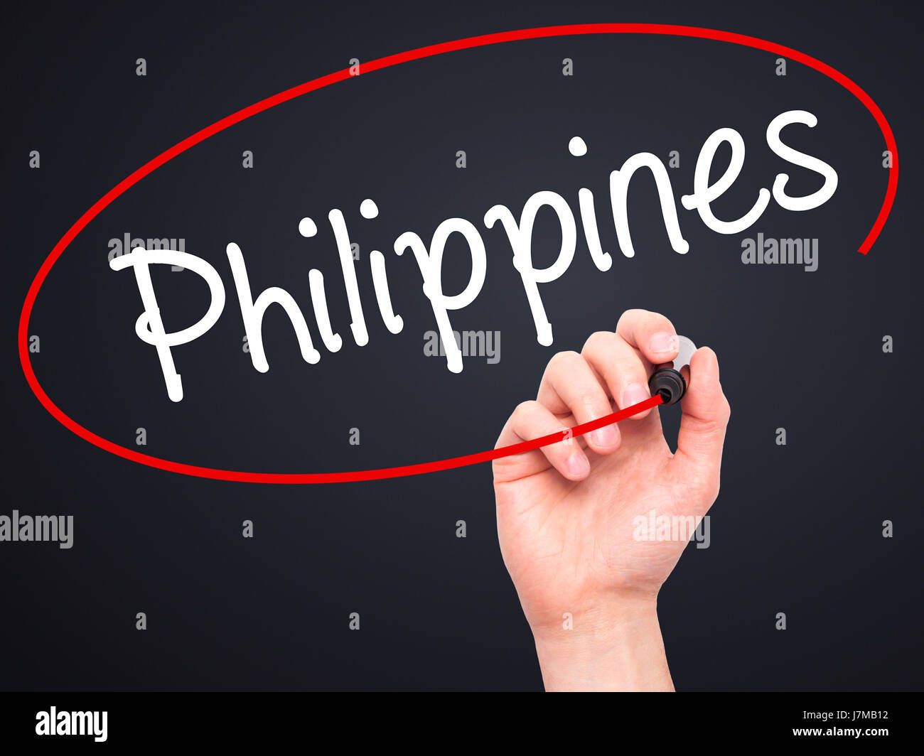Man Hand writing Philippines with black marker on visual screen. Isolated on black. Business, technology, internet concept. Stock Photo Stock Photo