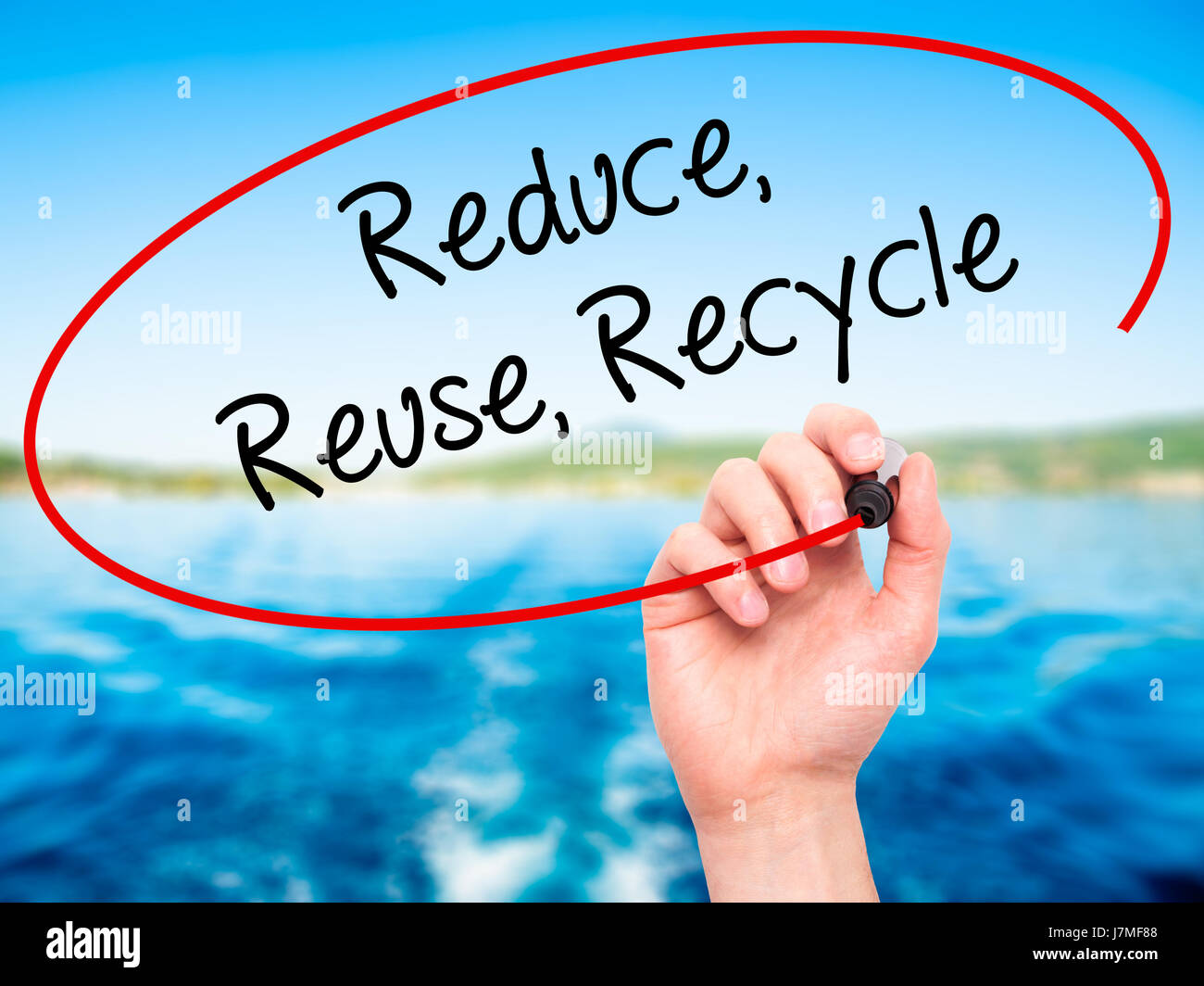 Man Hand writing Reduce Reuse Recycle with black marker on visual ...