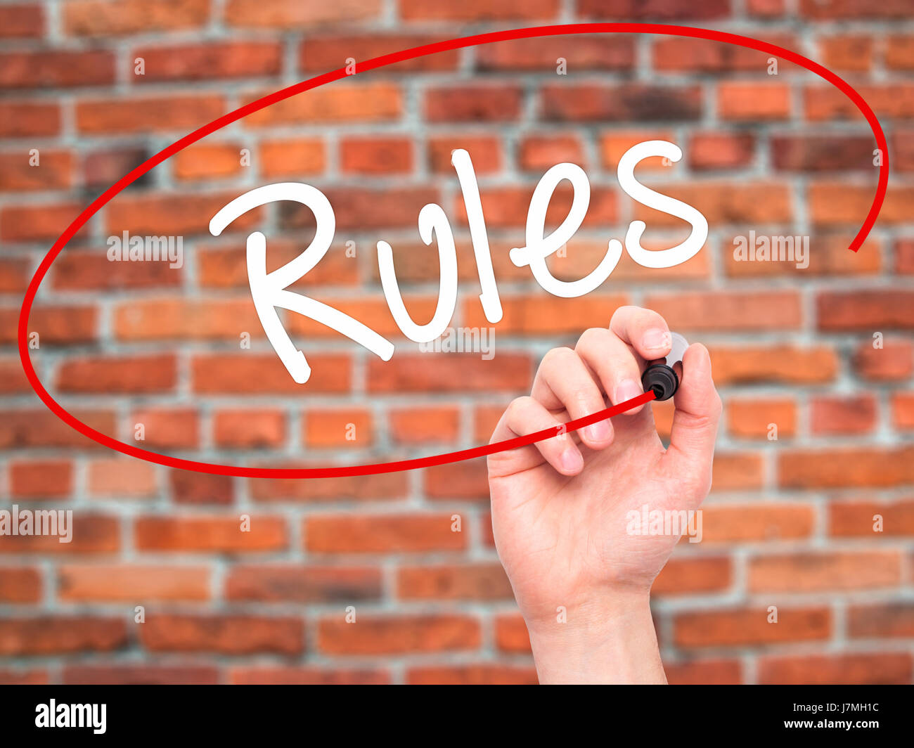 Man Hand writing Rules with black marker on visual screen. Isolated on ...