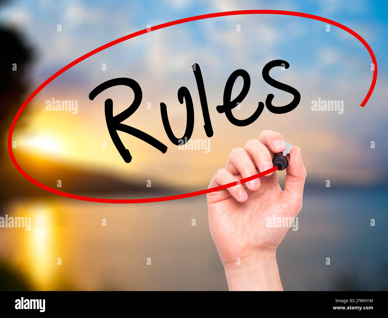 Man Hand writing Rules with black marker on visual screen. Isolated on ...