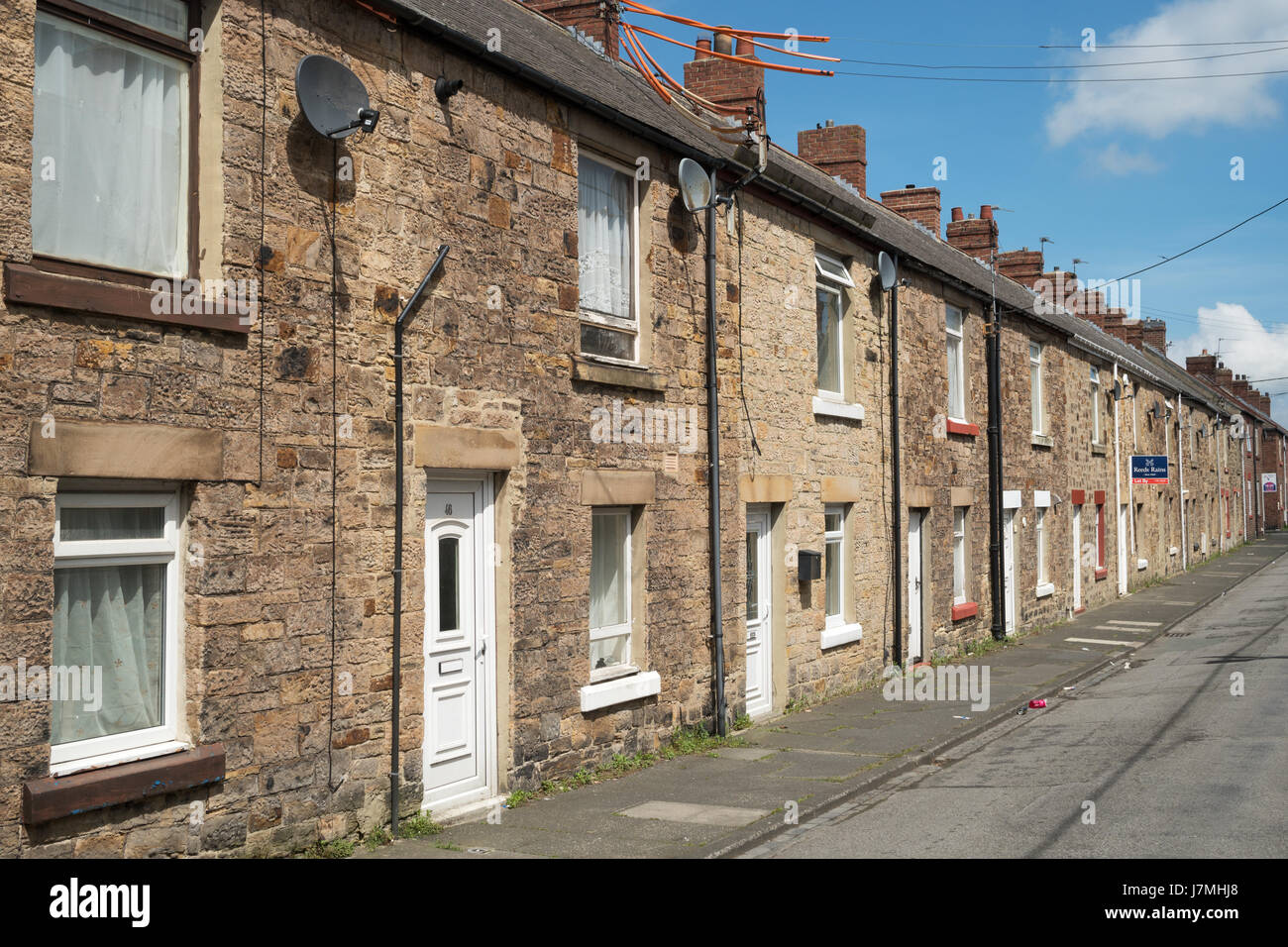 Terrace of ex miners' stone built cottages, South Cross St., Leadgate, Co. Durham, England, UK Stock Photo