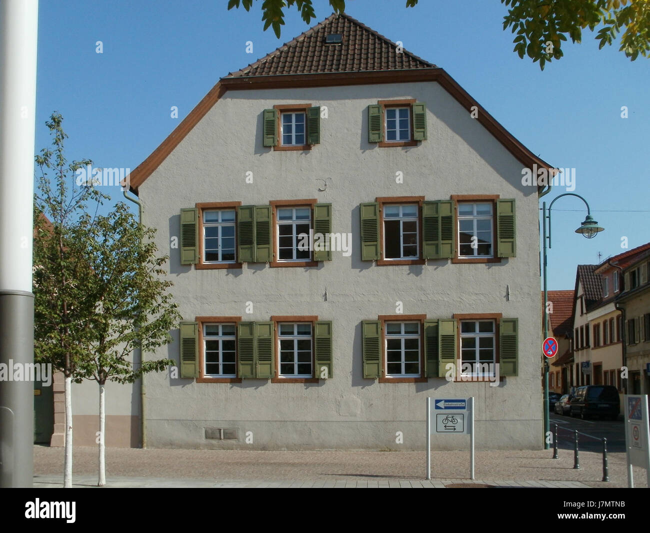 This is a photo of Heidelberger Strasse in Schwetzingen, Germany, taken on September 26, 2011. Schwetzingen is known for its historical landmarks and beautiful parks, including the famous Schwetzingen Palace and gardens. Stock Photo
