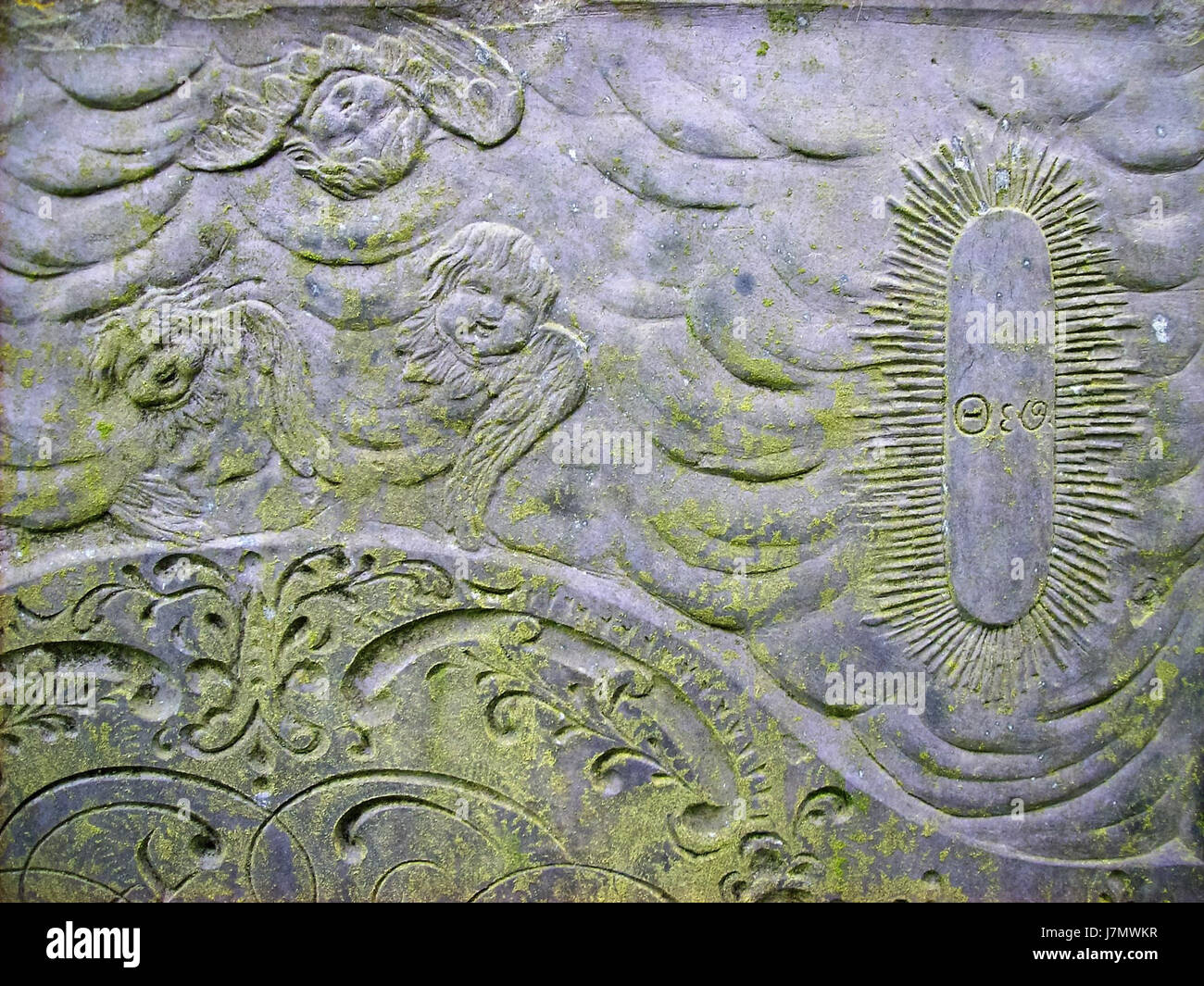 This 18th-century slate headstone from Blaby (04) represents an example of historical burial practices in rural England, crafted from local slate stone. Stock Photo