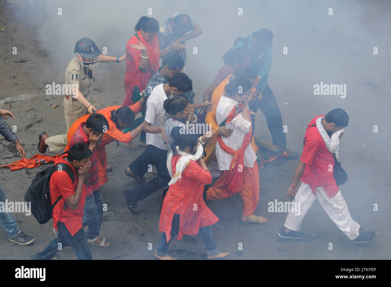KOLKATA, INDIA - MAY 25: Police using tear gas shell on the BJP workers ...