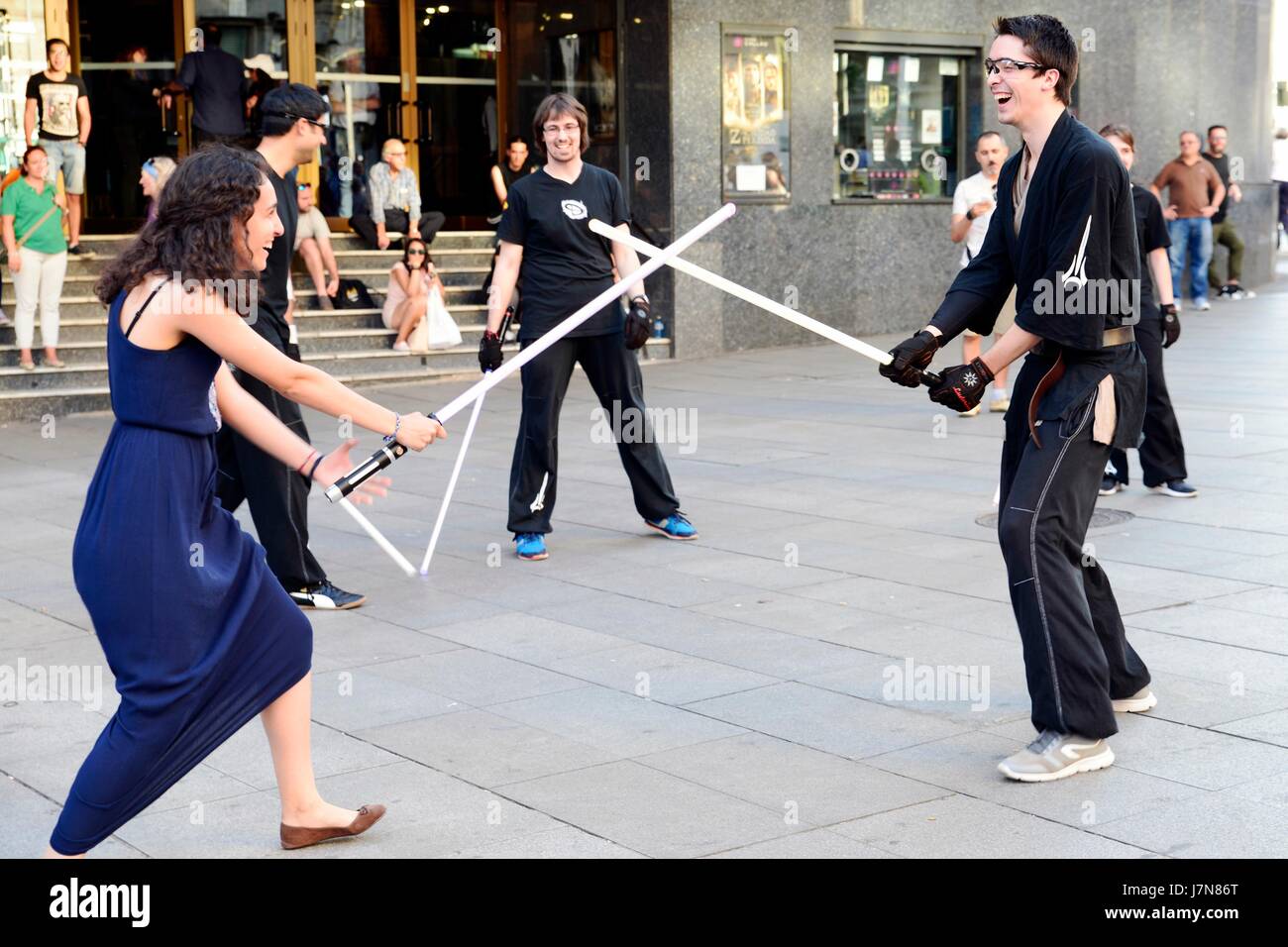 Madrid, Spain. 25th May 2017. Star Wars fans practicing the laser sword fight. May 25 is Geek Pride Day, initiative originated in Spain in 2006 as ' Dia del orgullo friki' and spread around the world via the Internet. Credit: M. Ramirez / Alamy Live News Stock Photo