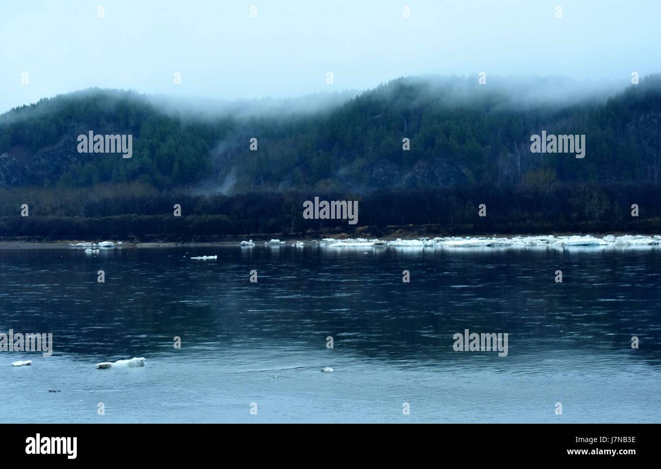China. 25th May, 2017. Heilongjiang, CHINA-May 3 2017: (EDITORIAL USE ONLY. CHINA OUT)The Heilongjiang River, the Sino-Russian boundary river, starts to melt in northeast China's Heilongjiang Province, May 3rd, 2017. Credit: SIPA Asia/ZUMA Wire/Alamy Live News Stock Photo