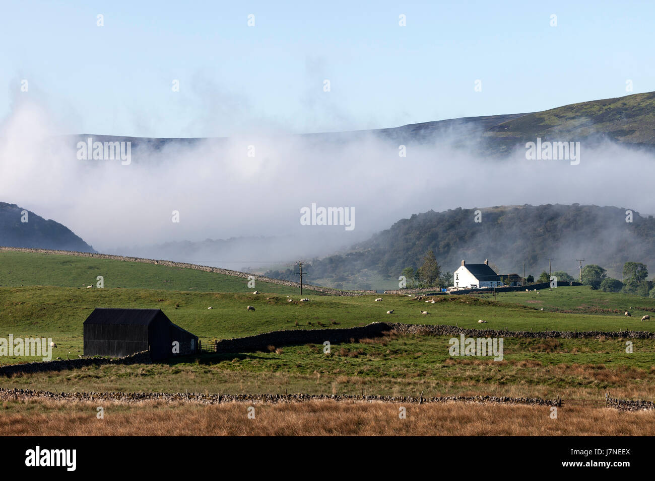 Forest-in-Teesdale, County Durham UK. Friday 26th May 2017.  UK Weather. Another hot sunny day in prospect in Northeast England as mist begins to break up around the farmsteads of Upper Teesdale in the North Pennines.  © David Forster/Alamy Live News. Stock Photo