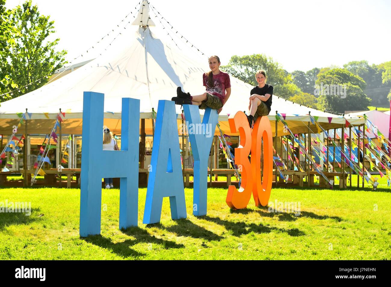 Hay on Wye, Wales UK, Friday 26 May 2017 UK Weather: People enjoying another day of clear blue skies and hot sunshine at the Hay Festival - which is this yer celebrating it's 30th anniversary. Temperatures in many parts of the UK will reach the high 20's centigrade today, before thundery weather rolls in from the west overnight and tomorrow morning Credit: keith morris/Alamy Live News Stock Photo