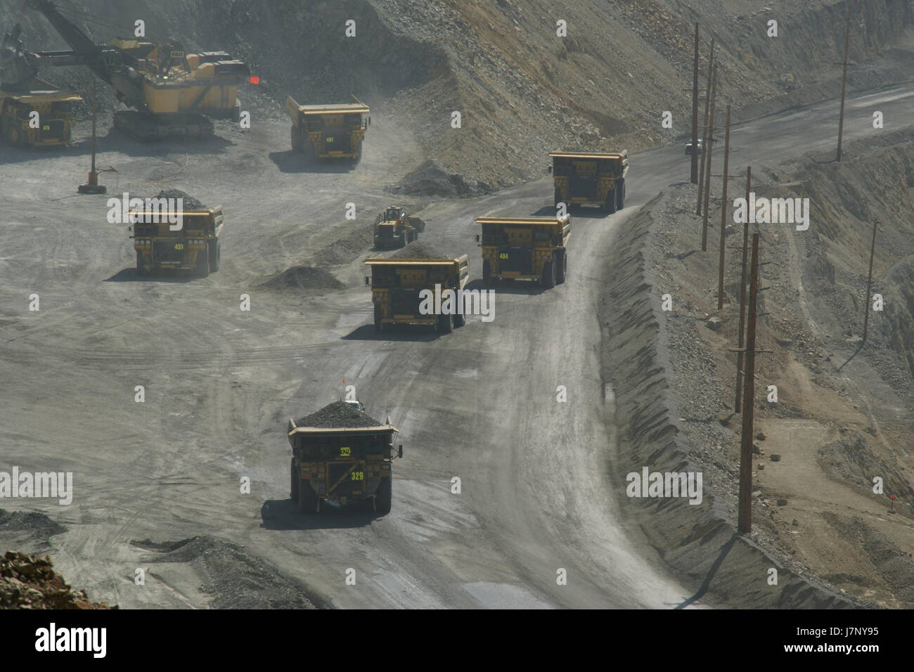 This photo from September 29, 2012, shows trucks operating at the Bingham Canyon Mine in Utah. The mine, one of the largest open-pit copper mines in the world, is known for its size and scale in the mining industry. Stock Photo
