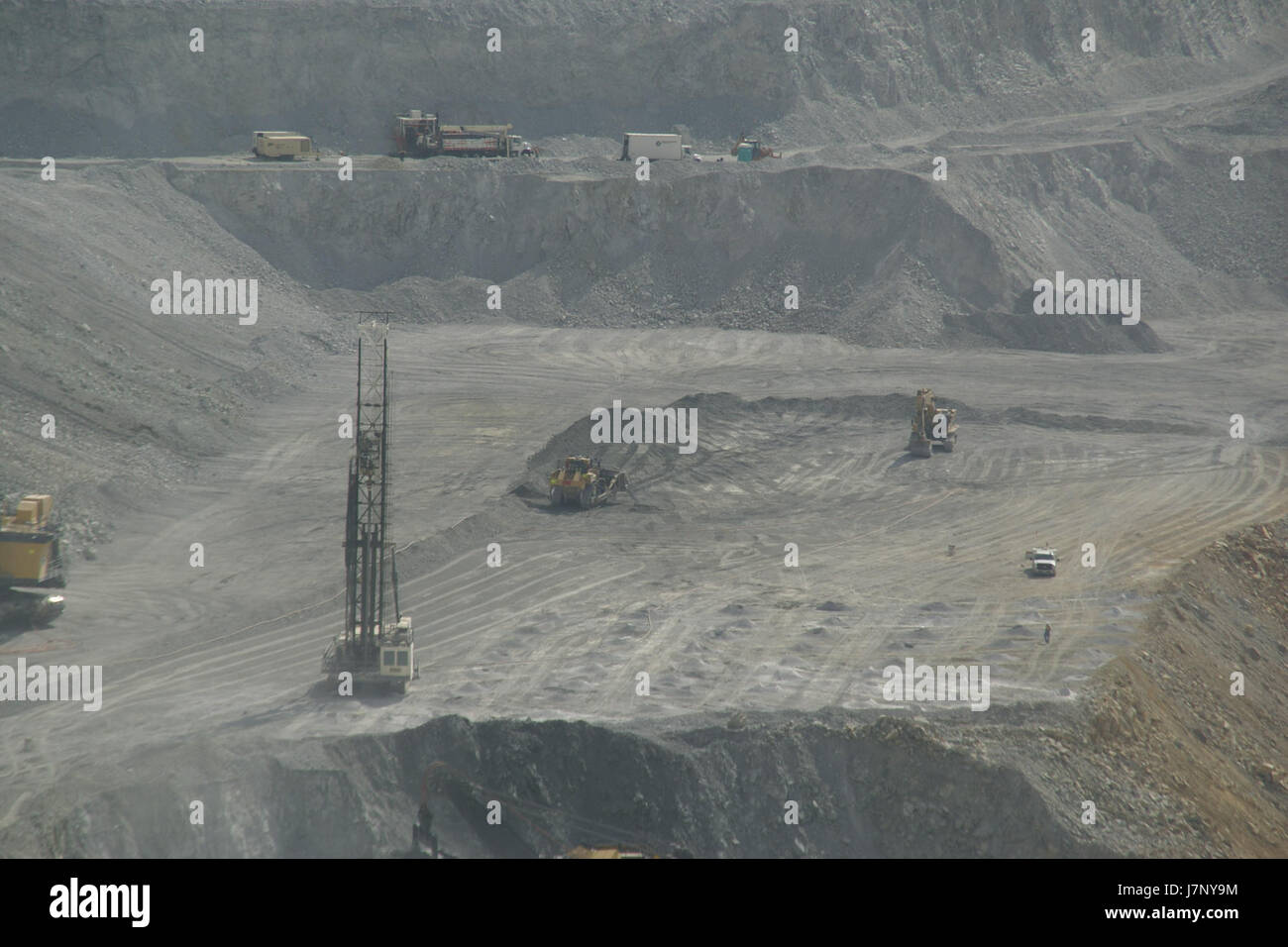 This image captures the Bingham Canyon Mine in Utah, a large open-pit copper mine known for its size and historical significance in mining and industrial activities in the United States. Stock Photo