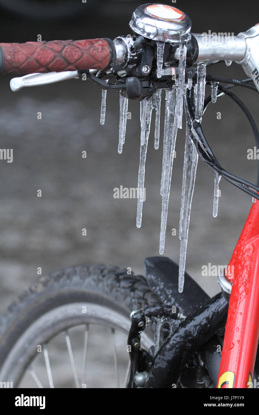 winter cold ice frost icicle icicles bell glazed frost bike bicycle cycle  sport Stock Photo - Alamy