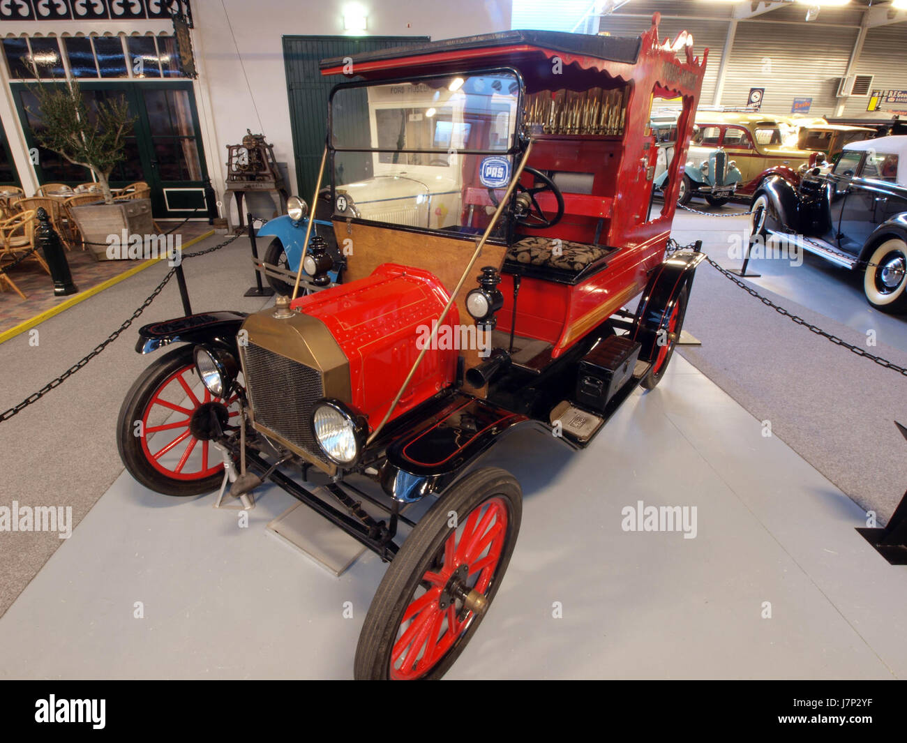 This image features a 1916 Ford Model T, a popular early automobile, equipped with a Calliaphone organ. The Ford Model T was known for revolutionizing the automobile industry, and the addition of the organ highlights its cultural significance. Stock Photo