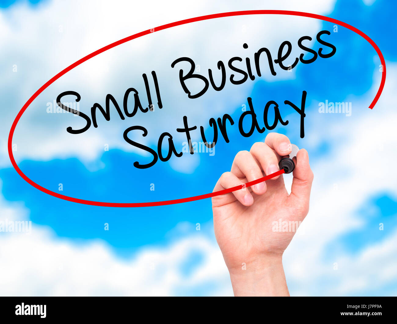 Saturday Visual Man Hand writing Small Business Saturday with black marker on visual ...
