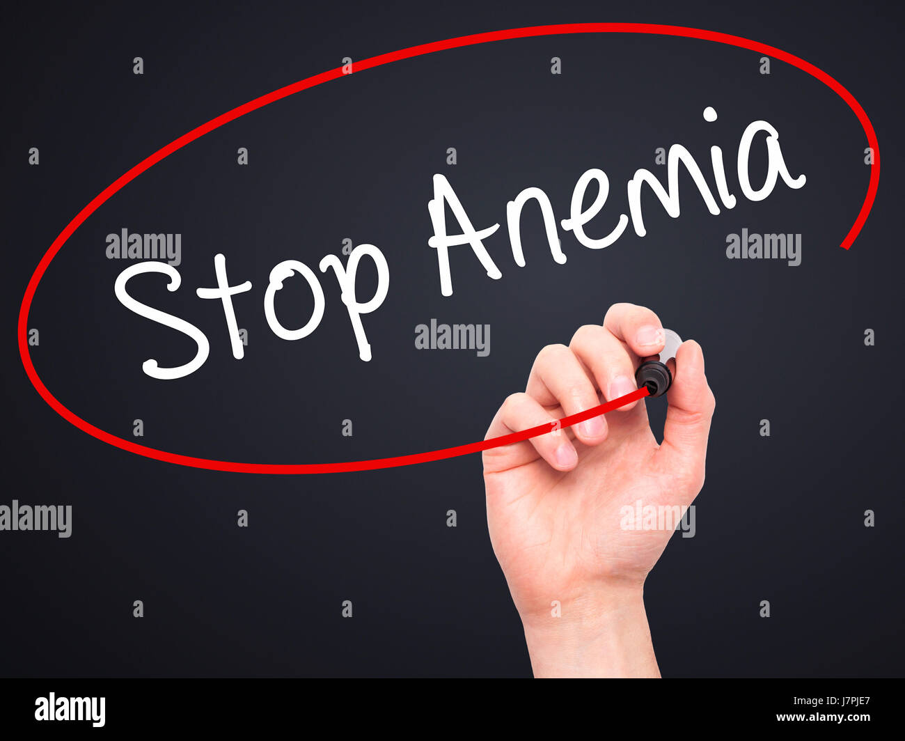 Man Hand writing Stop Anemia with black marker on visual screen. Isolated on background. Business, technology, internet concept. Stock Photo Stock Photo