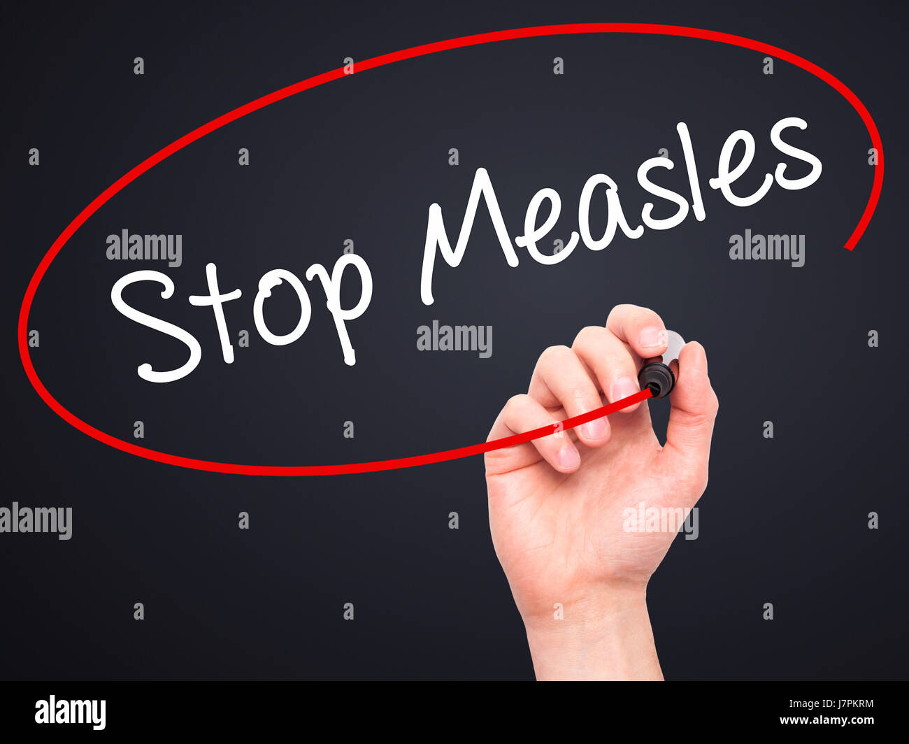Man Hand writing Stop Measles  with black marker on visual screen. Isolated on background. Business, technology, internet concept. Stock Photo Stock Photo