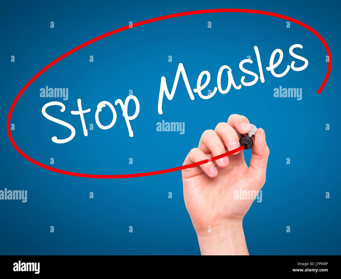 Man Hand writing Stop Measles  with black marker on visual screen. Isolated on background. Business, technology, internet concept. Stock Photo Stock Photo