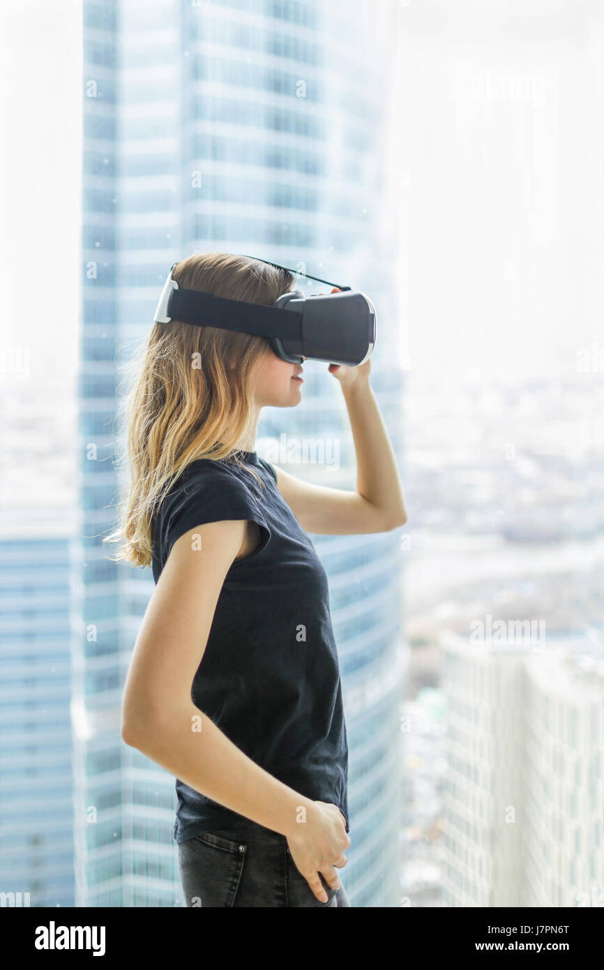 Young woman wearing vr glasses Stock Photo