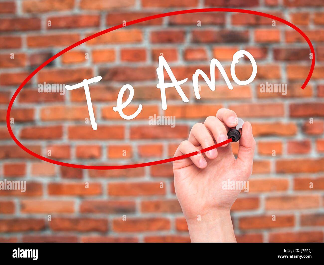 Man Hand Writing Te Amo I Love You In Spanish With Black Marker On