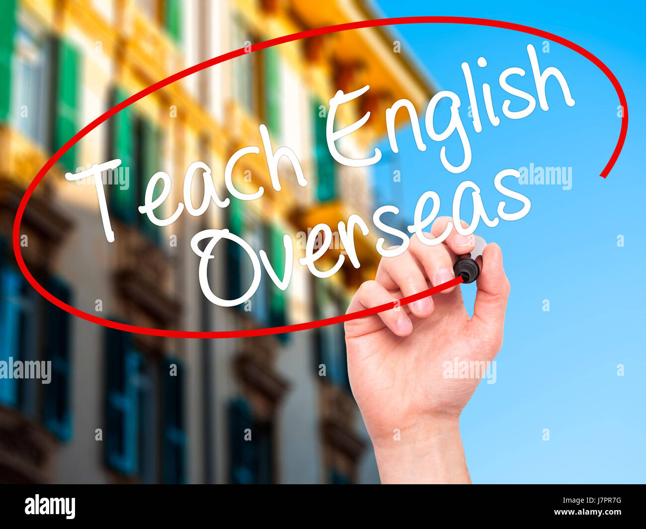 Man Hand writing Teach English Overseas with black marker on visual ...