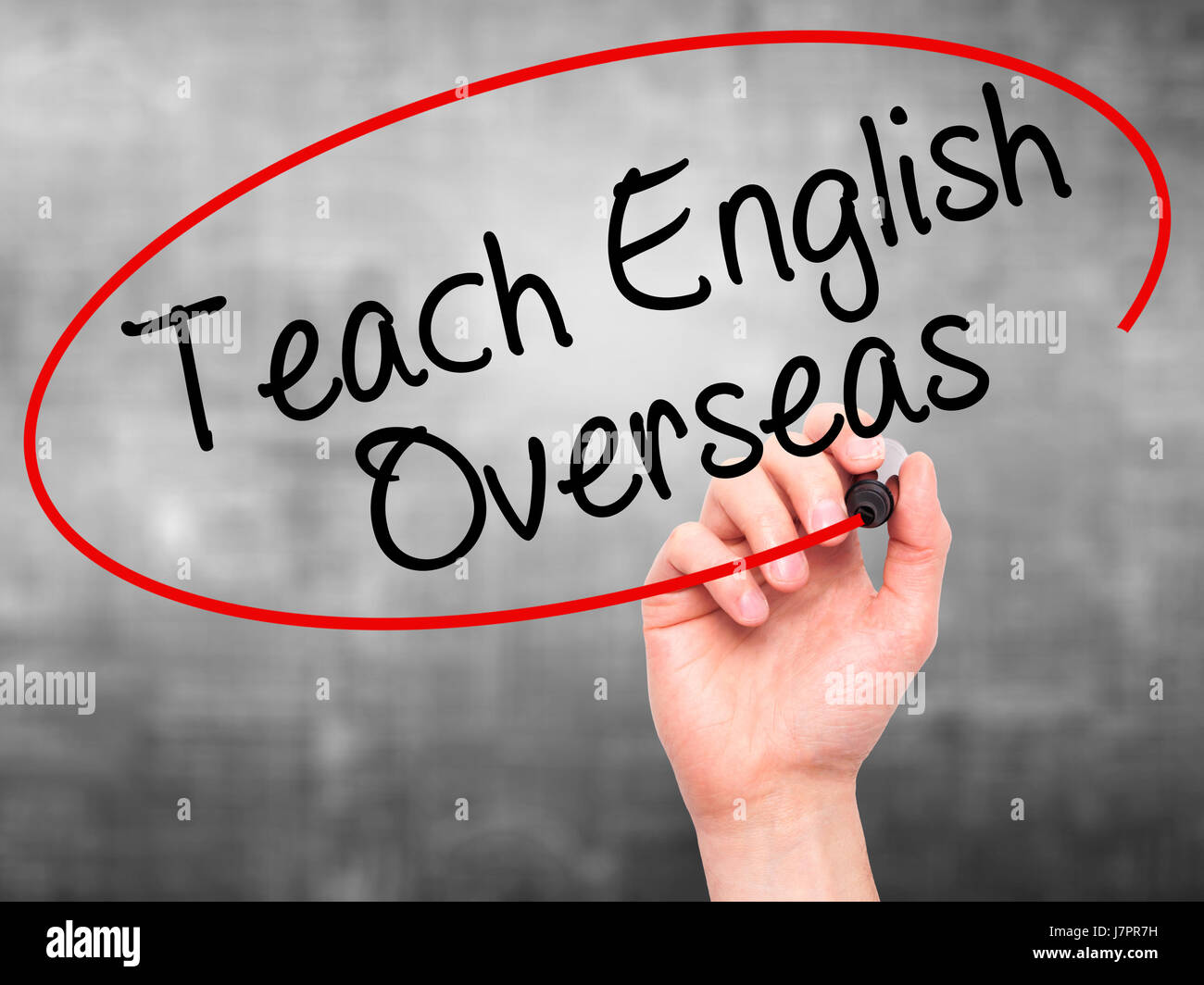 Man Hand writing Teach English Overseas with black marker on visual ...
