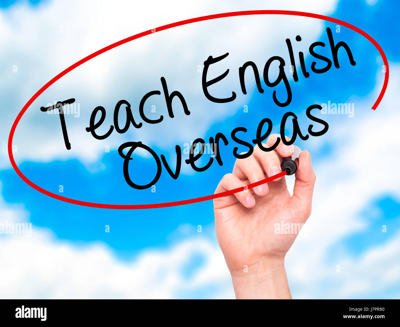Man Hand writing Teach English Overseas with black marker on visual ...