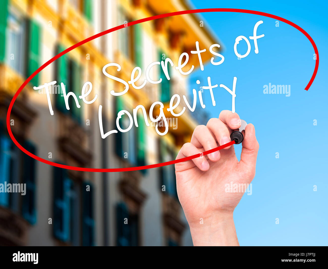 Man Hand writing The Secrets of Longevity with black marker on visual ...