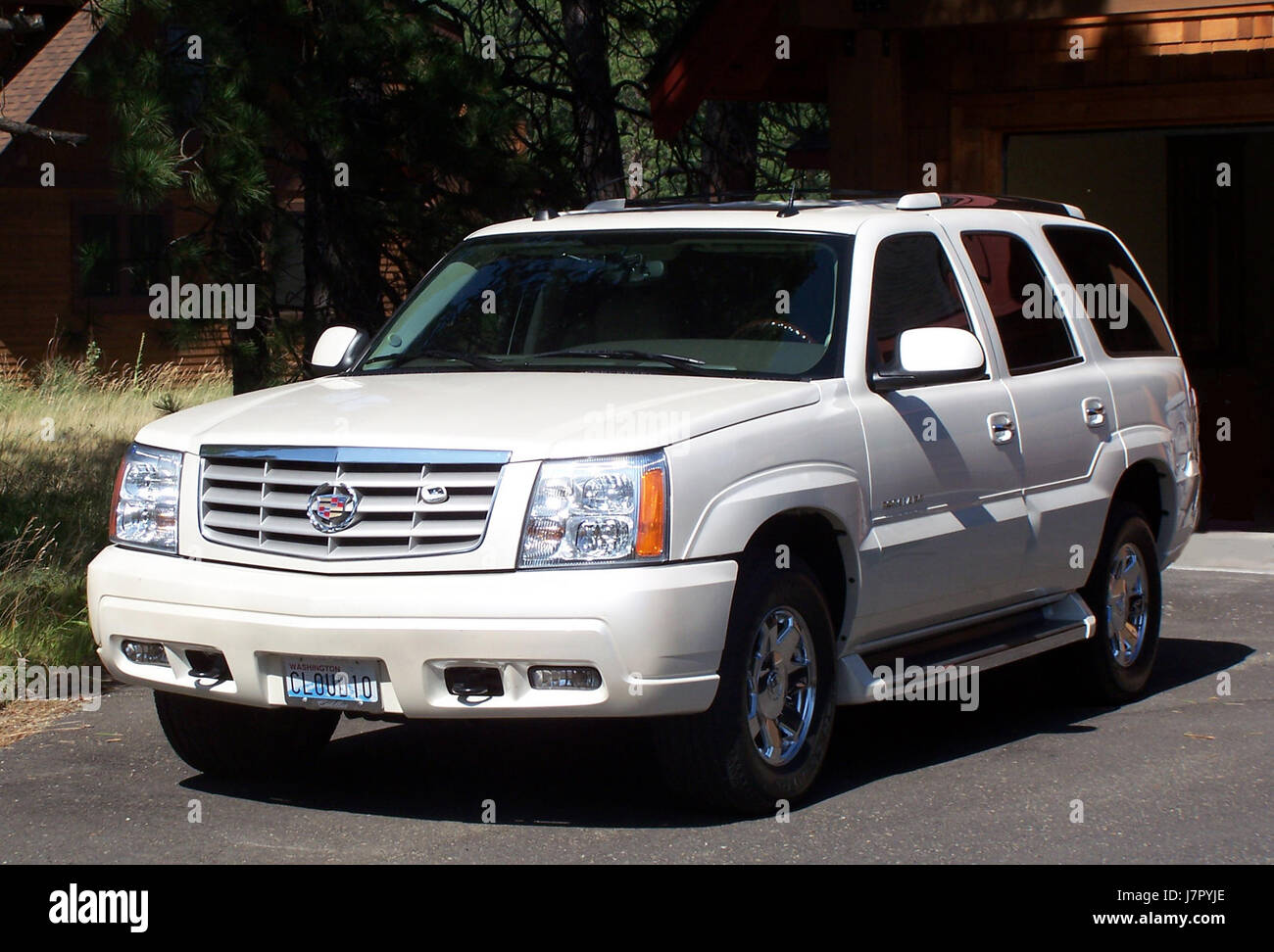 A detailed image of the front view of a 2005 Cadillac Escalade, a luxury SUV known for its bold design and premium features. The vehicle reflects American automotive craftsmanship and design innovation of the early 21st century. Stock Photo